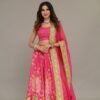 Studio portrait of a model wearing a blush pink occasion outfit